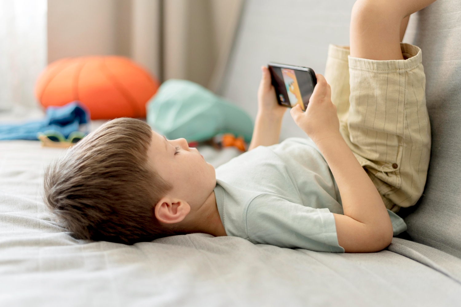 A boy playing game on smartphone
