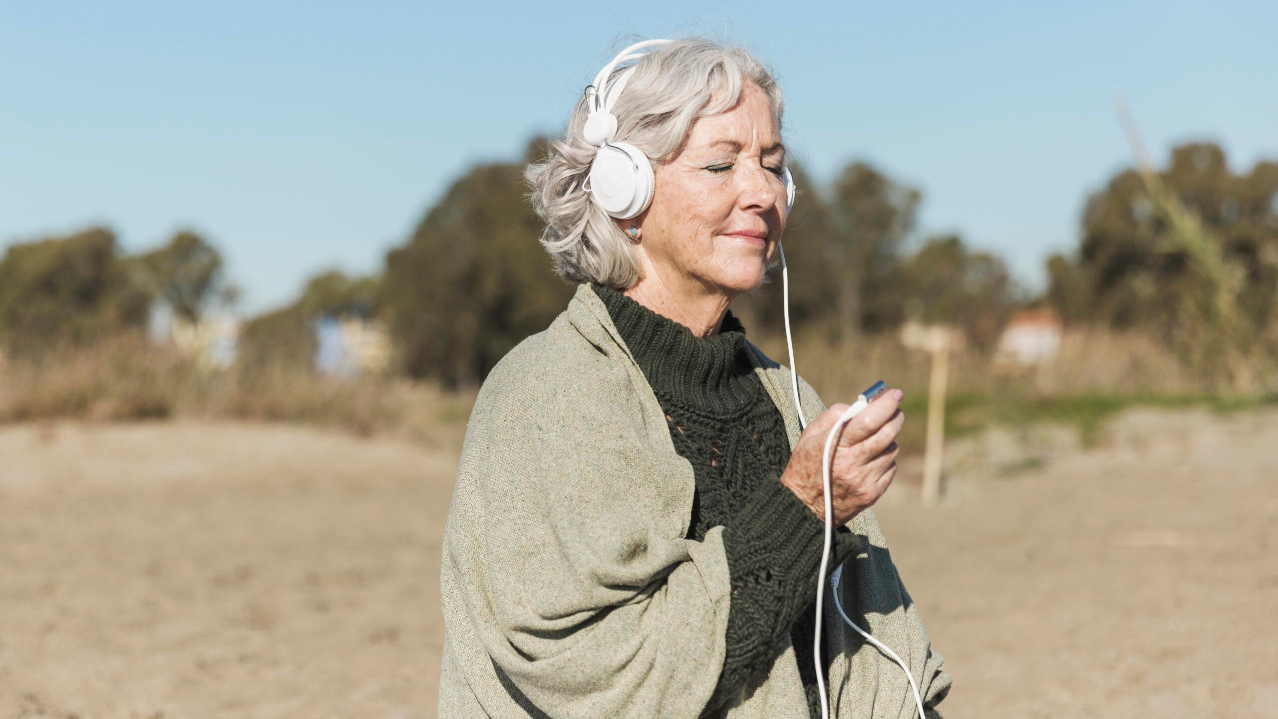 A woman enjoying the music in the nature