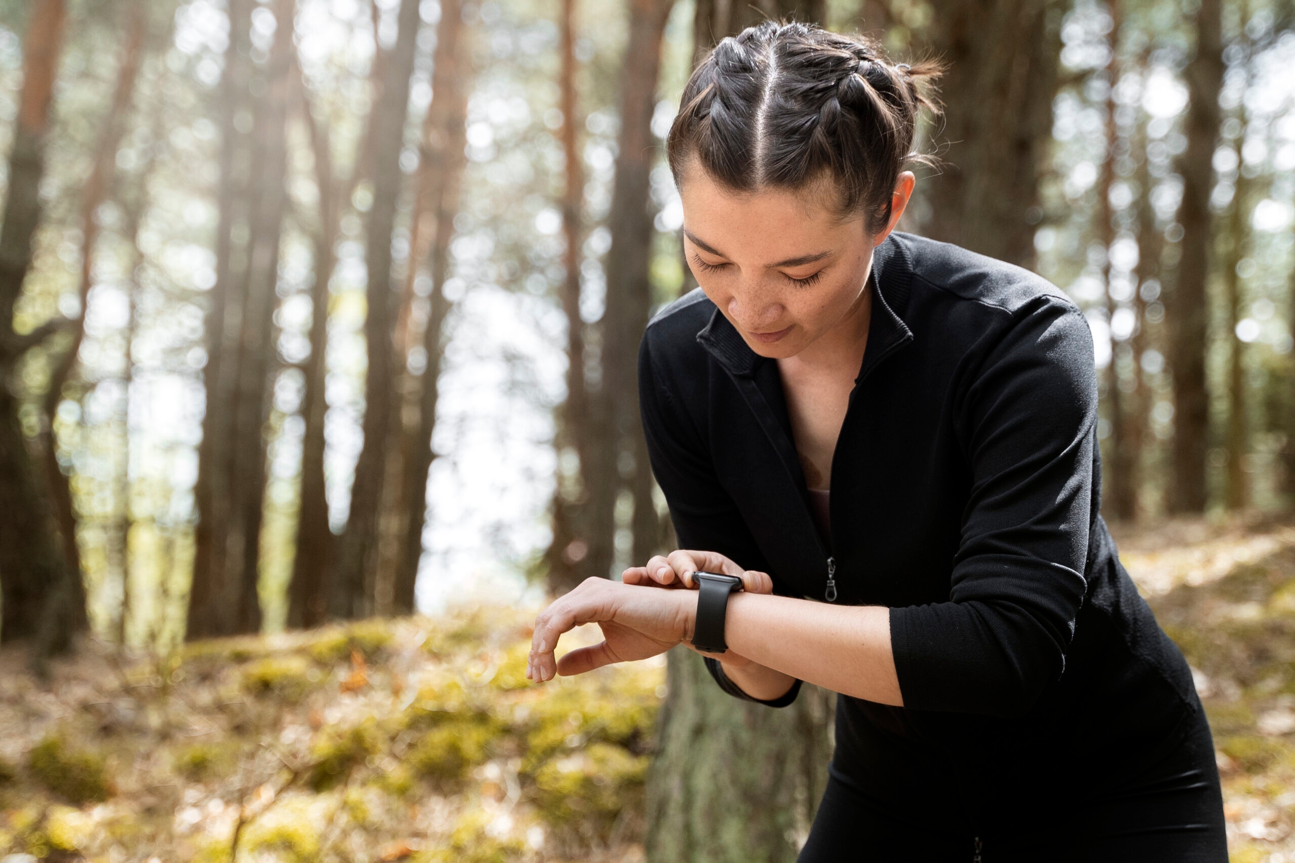 Woman checking her watch for health data