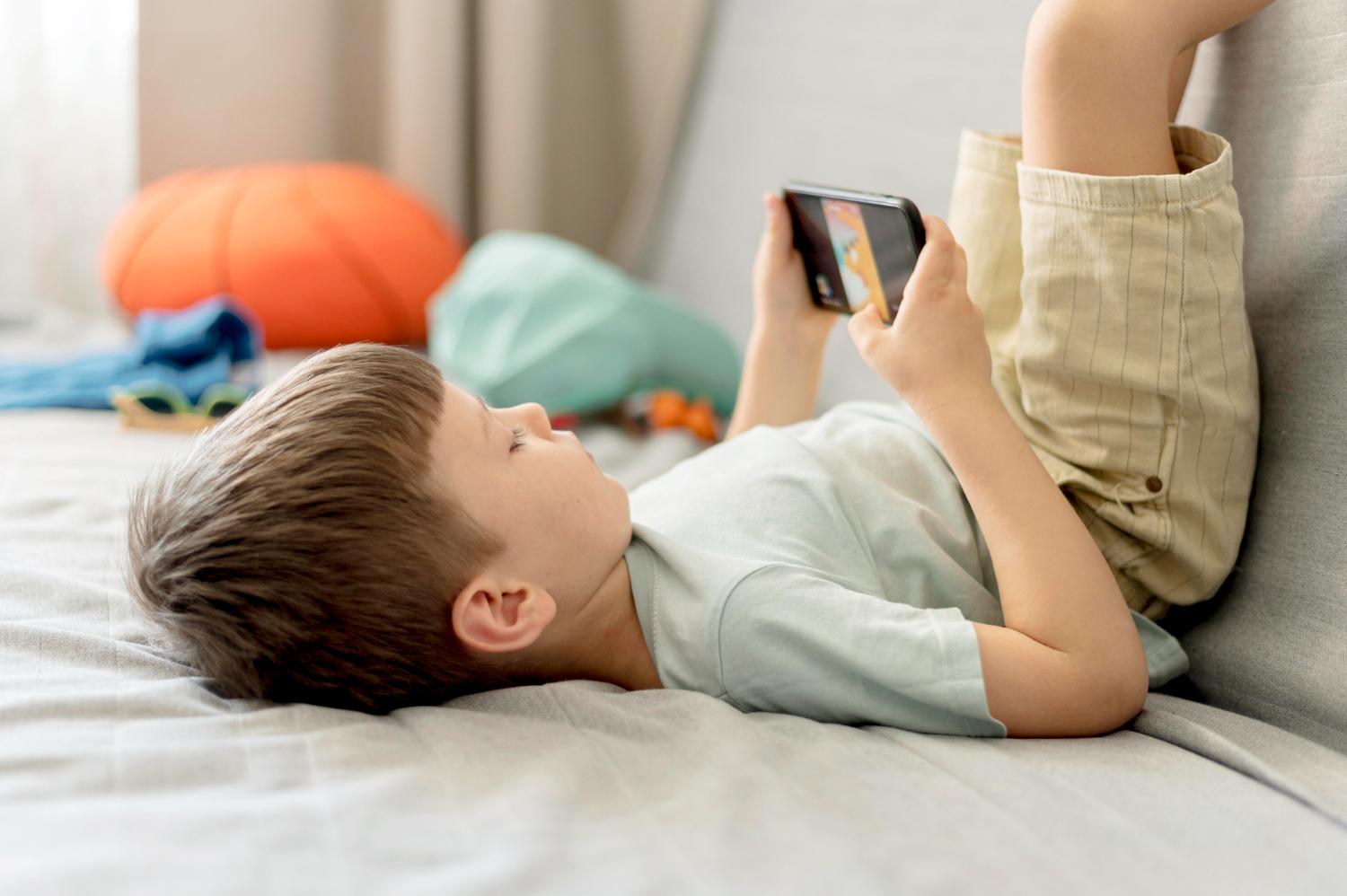 A boy playing game on smartphone